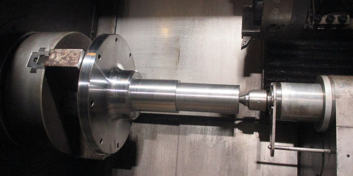 McLanahan log washer stub shaft, flanged, with 100 mm bearing journal and stainless seal sleeve, machined in Canada